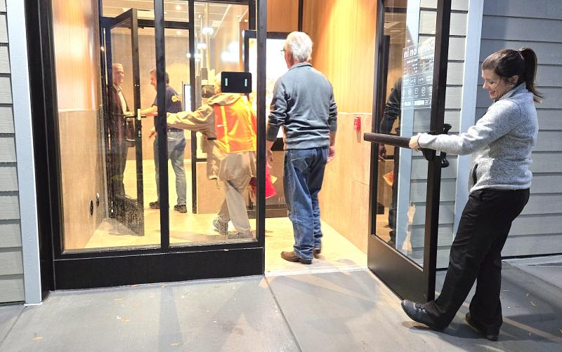 General Manager Becky Bryan opens the door, which means the McDonald’s is officially open.